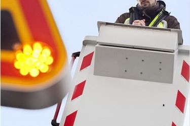 Photographie technicien Orange sur nacelle